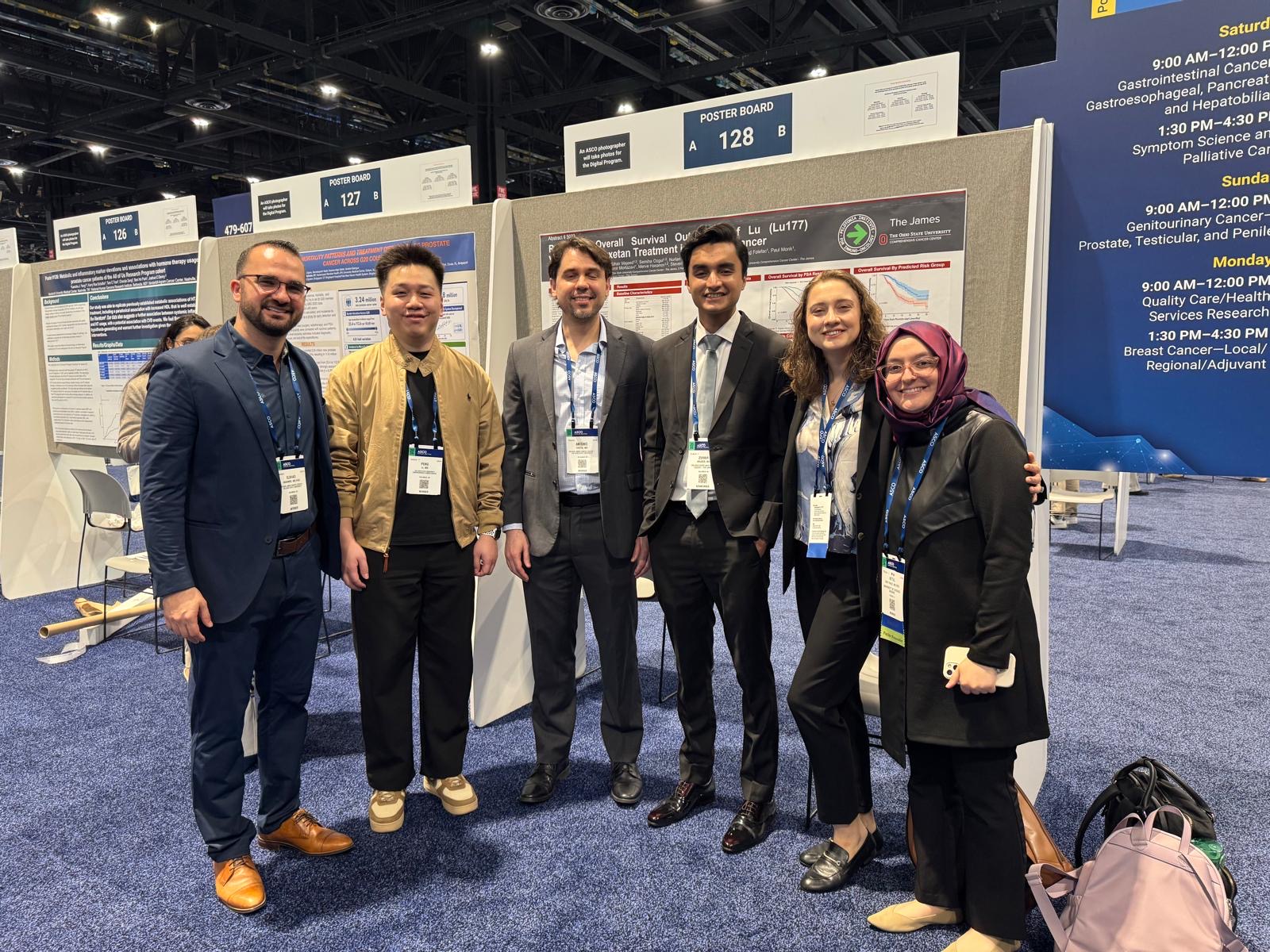 Group photo near ASCO 2026 poster boards